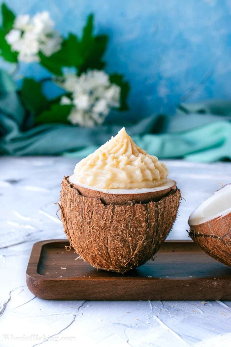 Coconut pastry cream piped inside fresh coconut.