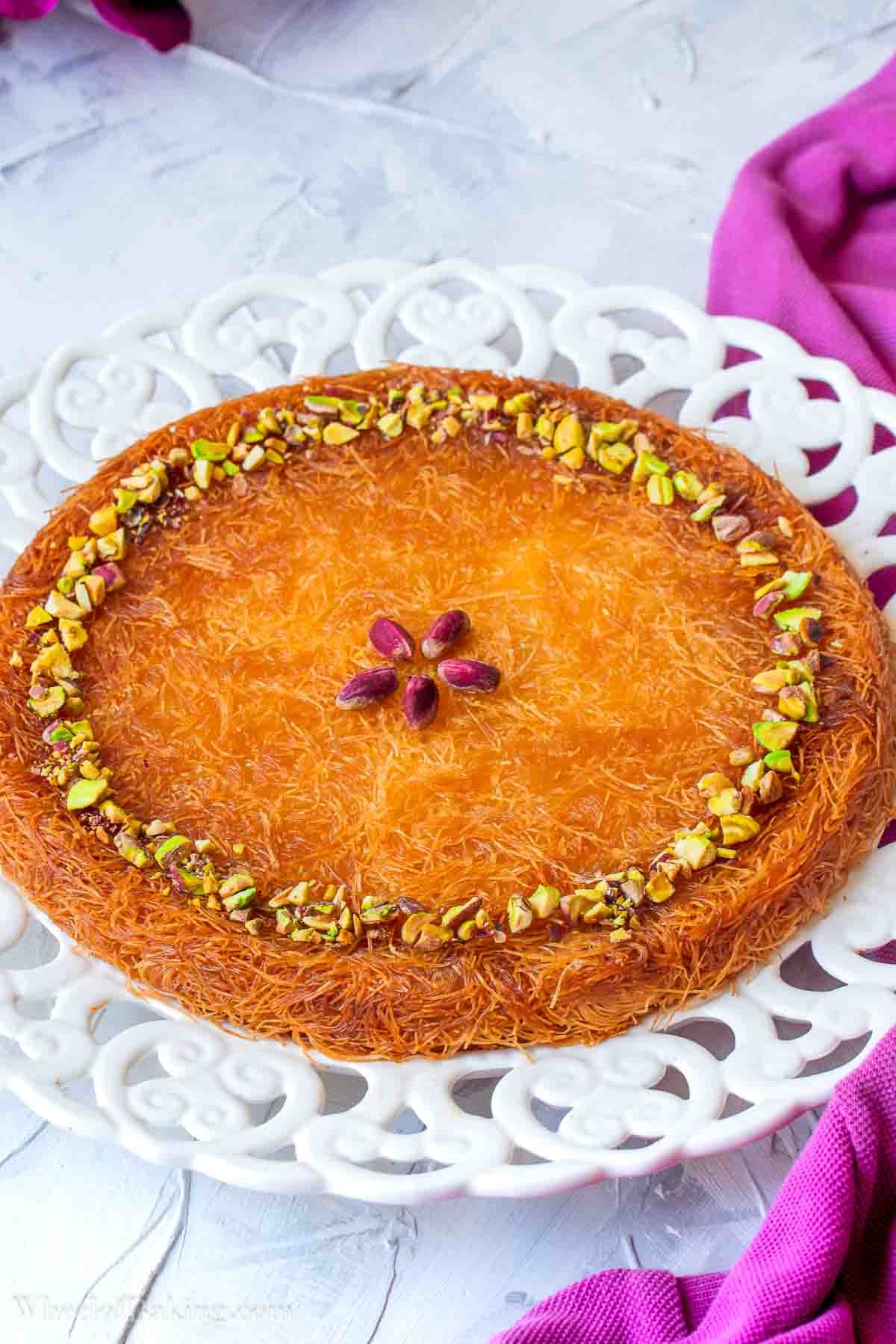 Turkish kunefe decorated with pistachios.